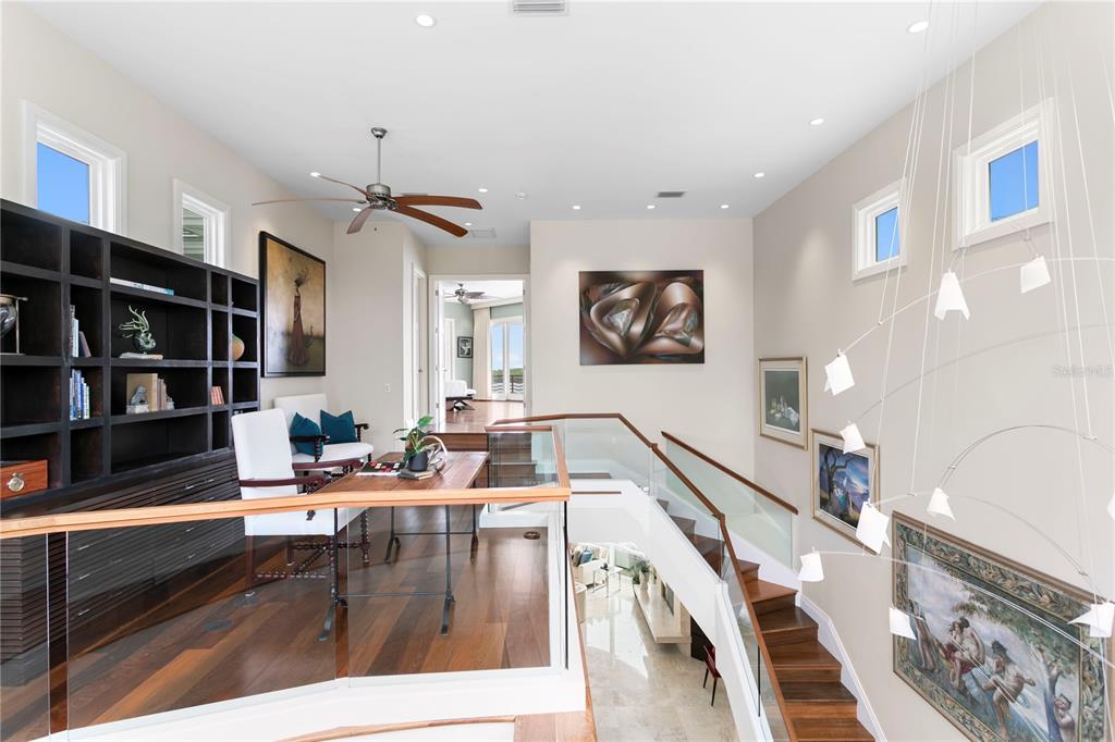 2279 Mermaid Point Northeast St. Petersburg, FL 33703 - Photo 69 of 100 a living room with furniture and a flat screen tv