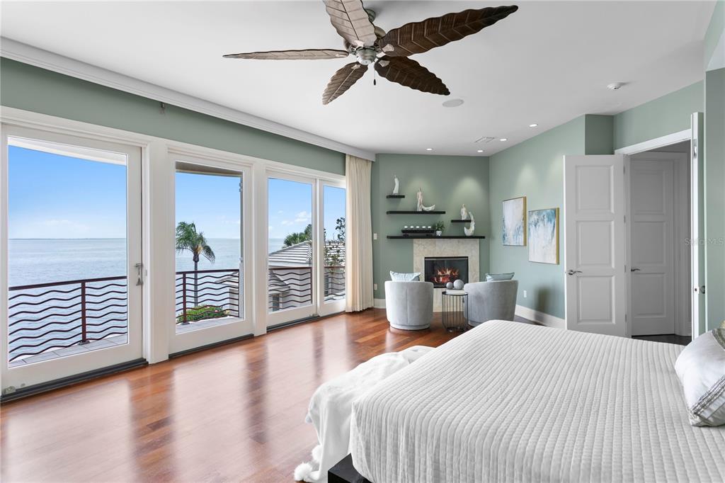 2279 Mermaid Point Northeast St. Petersburg, FL 33703 - Photo 72 of 100 a bedroom with a large bed and a chandelier