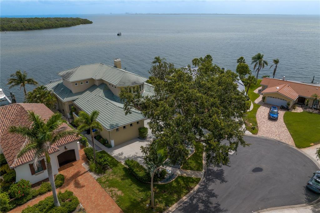 2279 Mermaid Point Northeast St. Petersburg, FL 33703 - Photo 82 of 100 an aerial view of a house with lots of trees and ocean view