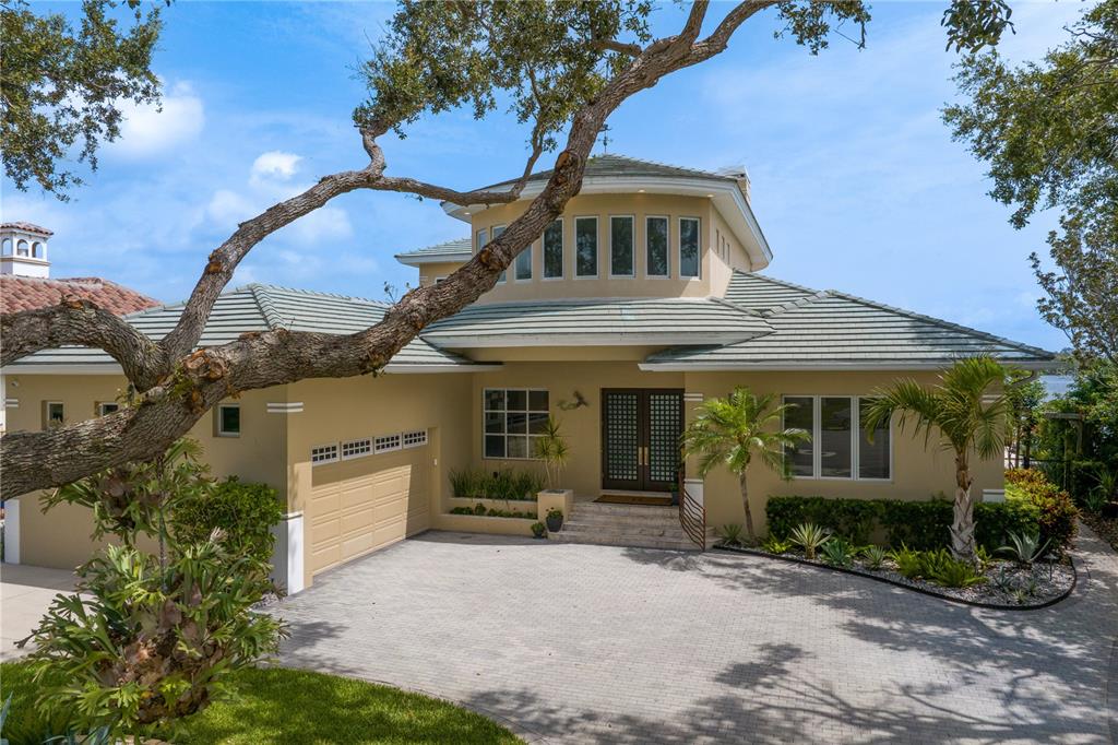 2279 Mermaid Point Northeast St. Petersburg, FL 33703 - Photo 84 of 100 a front view of a house with garden