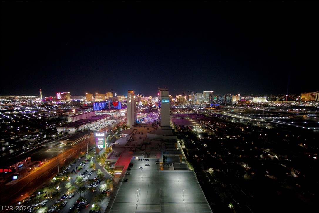 4381 West Flamingo Road, Unit 3616 Las Vegas, NV 89103 - Photo 4 of 29 City lights shimmer across the dynamic metropolitan panorama, offering an unparalleled urban vista.