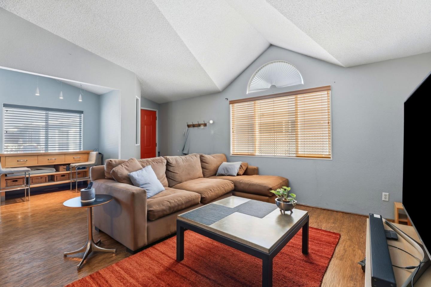20 Russell Road, Unit 8 Salinas, CA 93906 - Photo 6 of 38 a living room with furniture and a flat screen tv