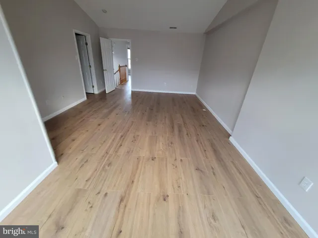 a bathroom with a double vanity sink mirror and bathtub