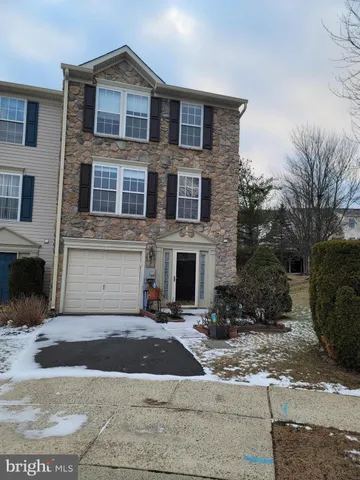 a front view of a house with yard