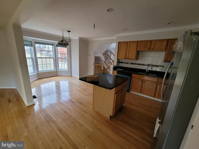a kitchen with granite countertop a stove and a sink