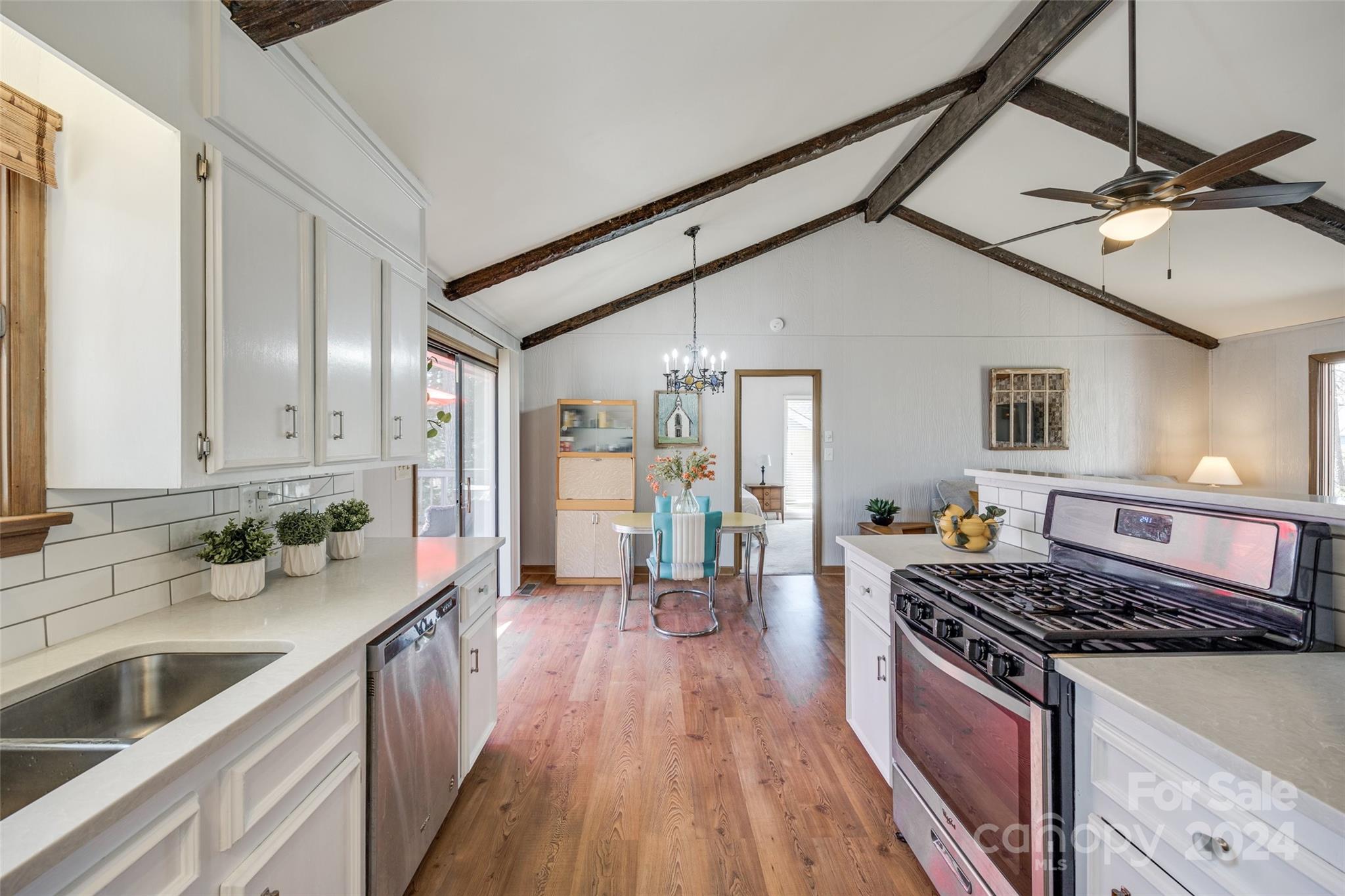 16039 Samoa Court Fort Mill, SC 29708 - Photo 12 of 30 a kitchen with stove and wooden floor