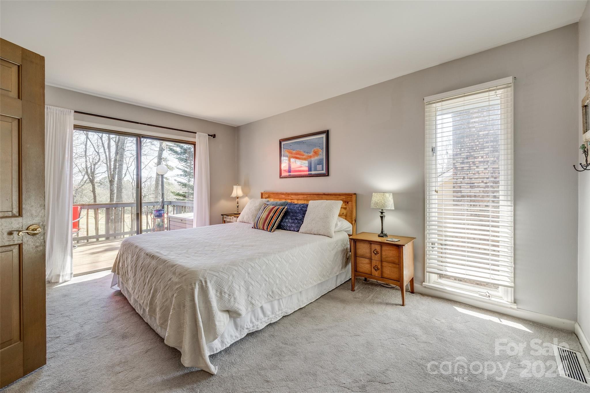 16039 Samoa Court Fort Mill, SC 29708 - Photo 13 of 30 a bedroom with a bed and a large window