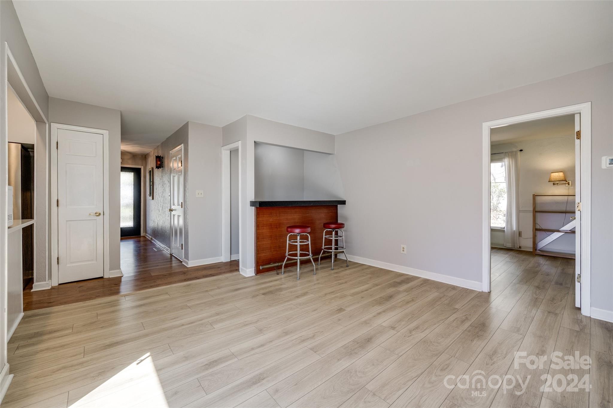 16039 Samoa Court Fort Mill, SC 29708 - Photo 18 of 30 a view of a livingroom with wooden floor and a fireplace