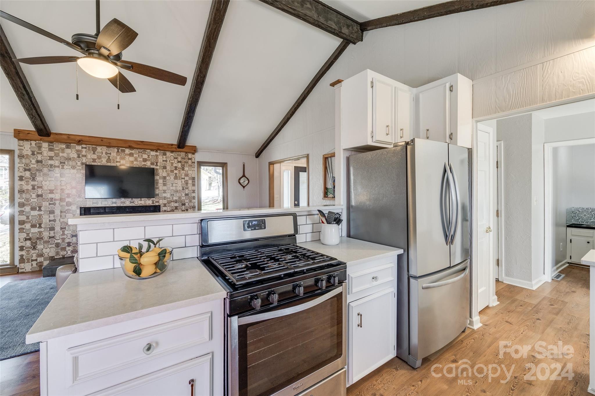 16039 Samoa Court Fort Mill, SC 29708 - Photo 10 of 30 a kitchen with stainless steel appliances a stove a refrigerator and a sink