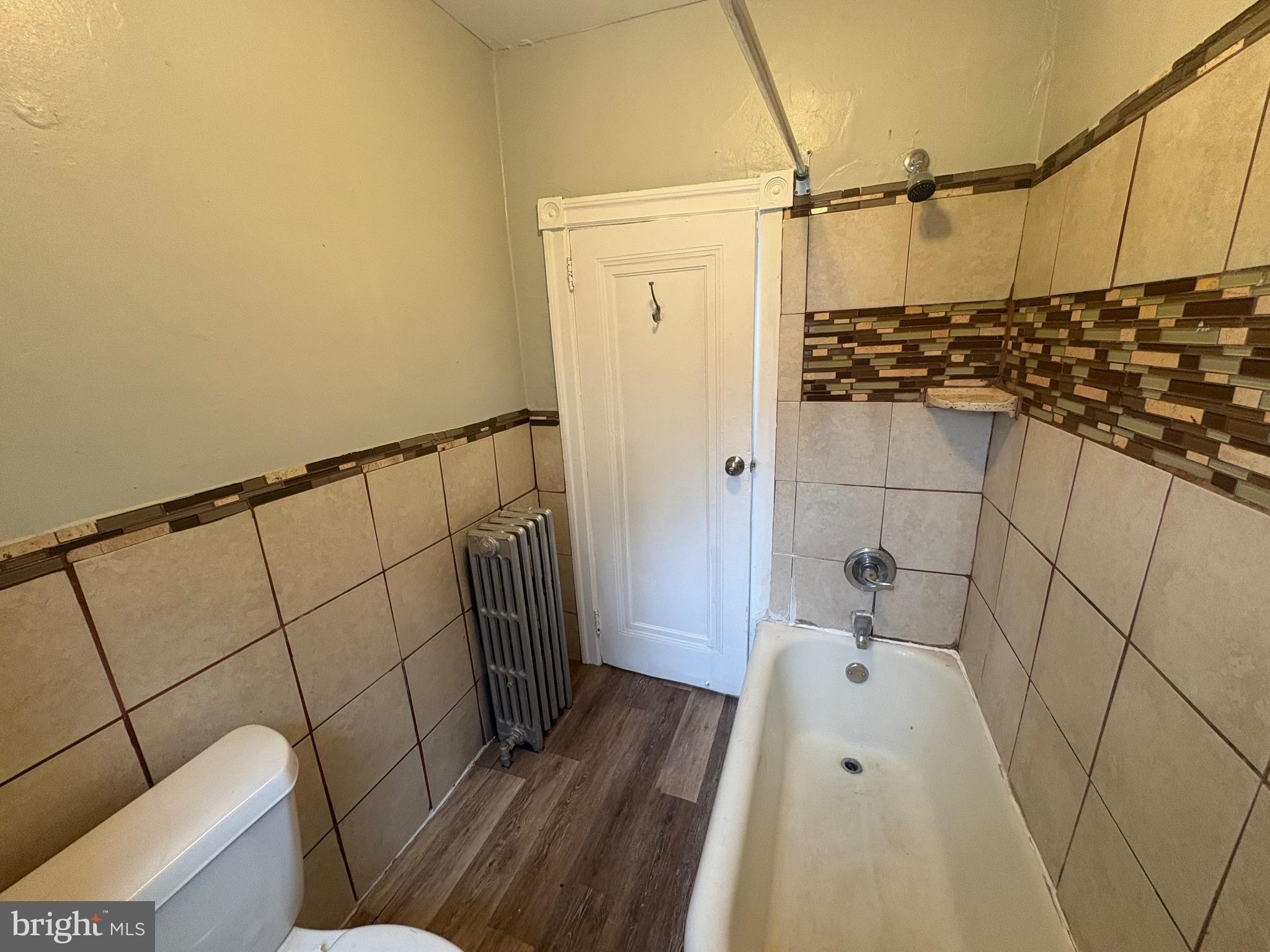 1337 71st Avenue, Unit 2 Philadelphia, PA 19126 - Photo 9 of 16 a bathroom with a bathtub and toilet