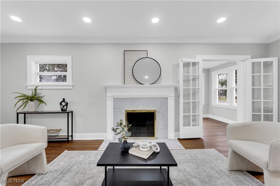 2593 Princeton Road Cleveland, OH 44118 - Photo 11 of 34 Living area featuring dark wood finished floors, recessed lighting, and ornamental molding