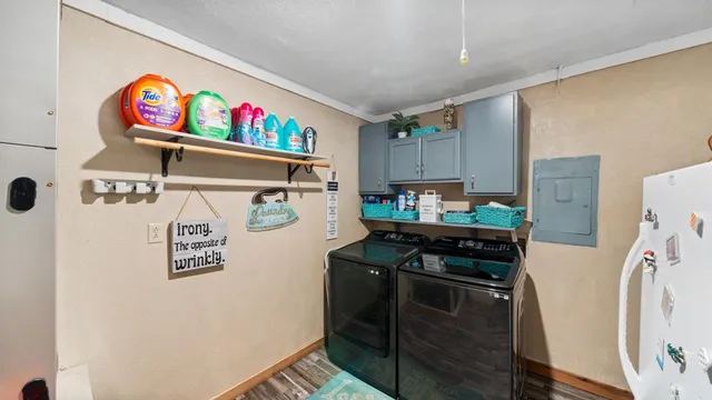 a kitchen with stainless steel appliances a stove a refrigerator and a dining table