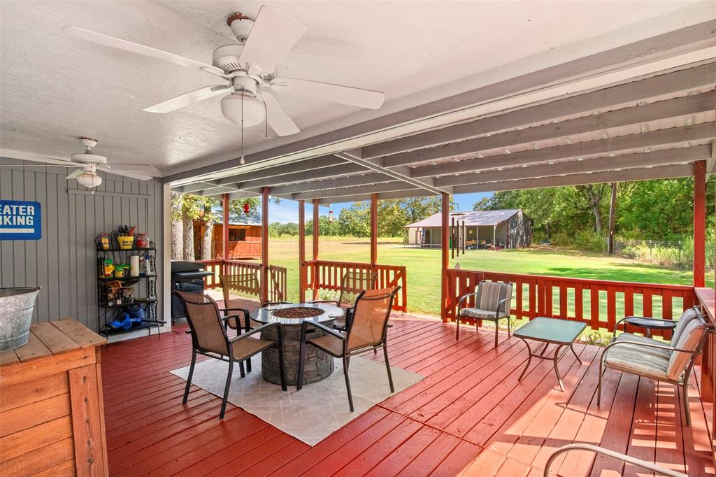 14802 North 3rd Street Scurry, TX 75158 - Photo 20 of 40 a view of a dining room with furniture window and wooden floor