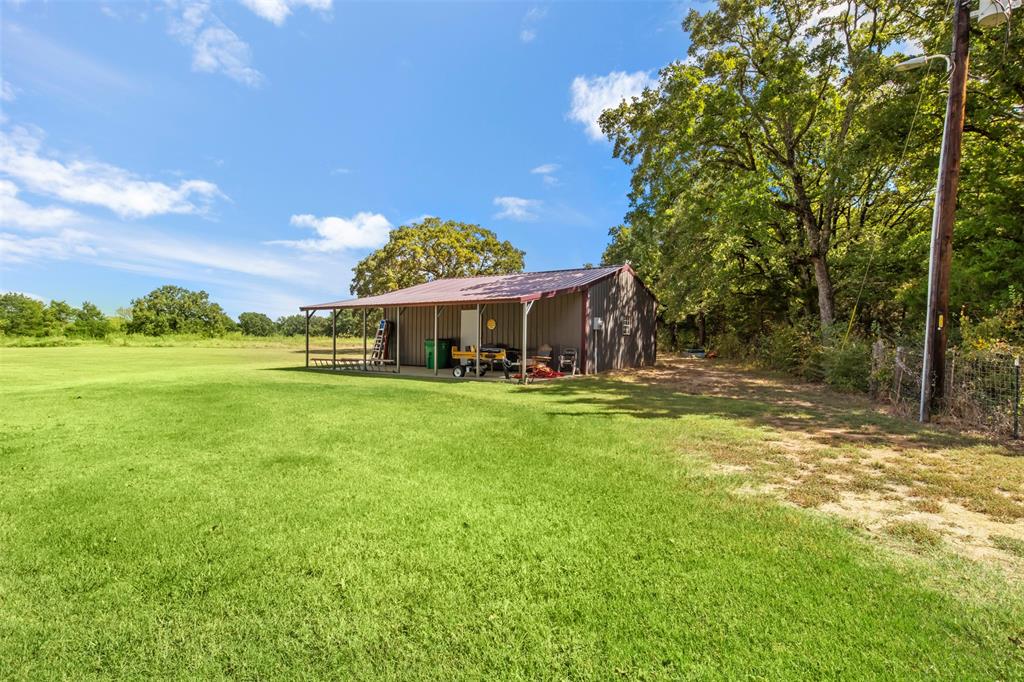 14802 North 3rd Street Scurry, TX 75158 - Photo 23 of 40 a front view of a house with a yard