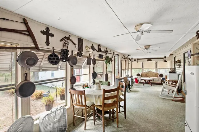 a view of living room and dining room with furniture