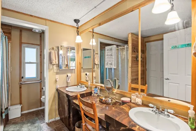 a bathroom with a sink double vanity and a mirror