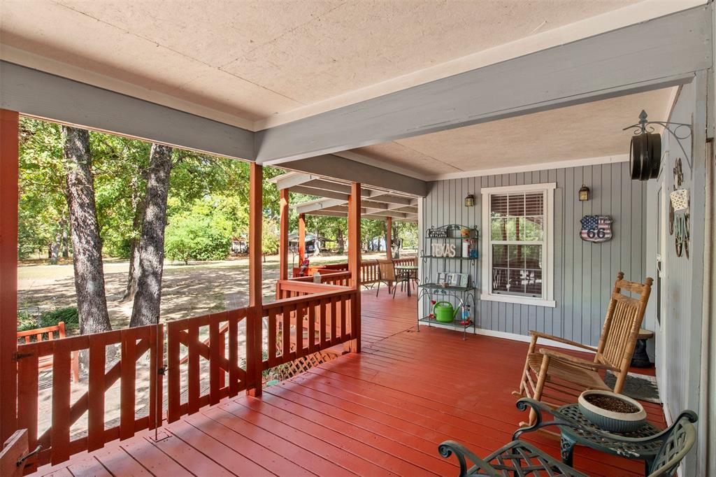14802 North 3rd Street Scurry, TX 75158 - Photo 3 of 40 a view of a room with wooden floor and furniture