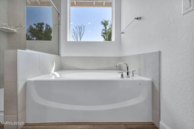 a white bath tub sitting in a bathroom