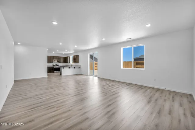 a view of kitchen and kitchen with furniture wooden floor