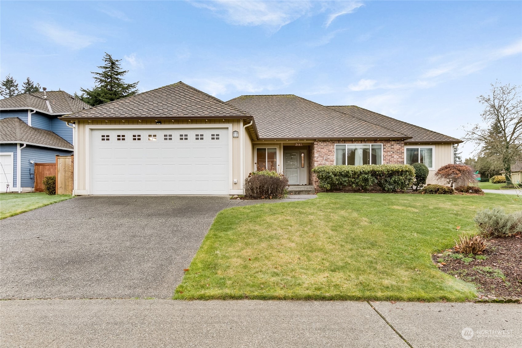2667 Southwest 343rd Street Federal Way, WA 98023 - Photo 1 of 24 a front view of a house with garden