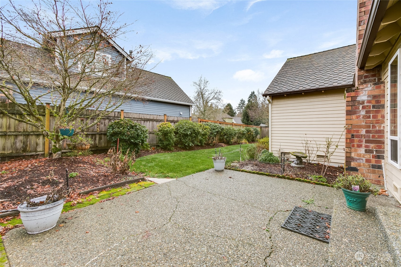 2667 Southwest 343rd Street Federal Way, WA 98023 - Photo 20 of 24 a backyard of a house with barbeque oven table and chairs