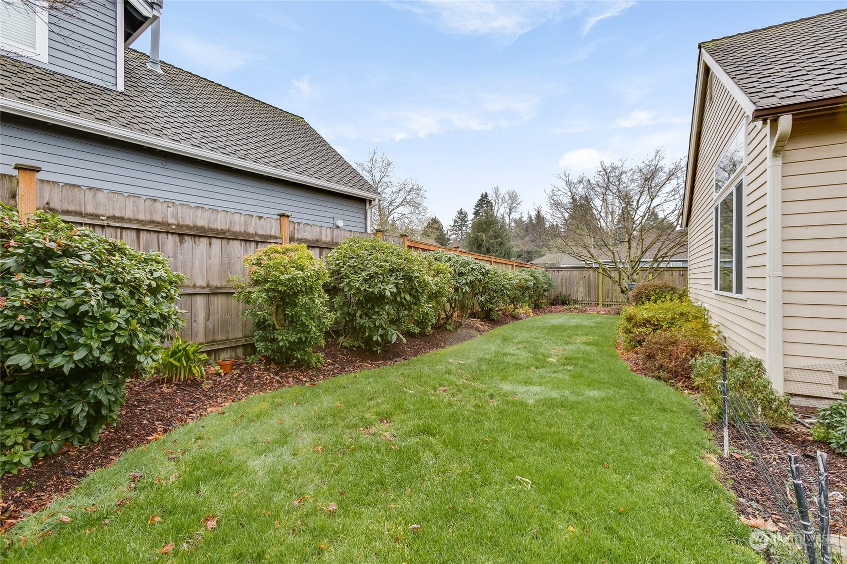 2667 Southwest 343rd Street Federal Way, WA 98023 - Photo 21 of 24 a backyard of a house with lots of green space