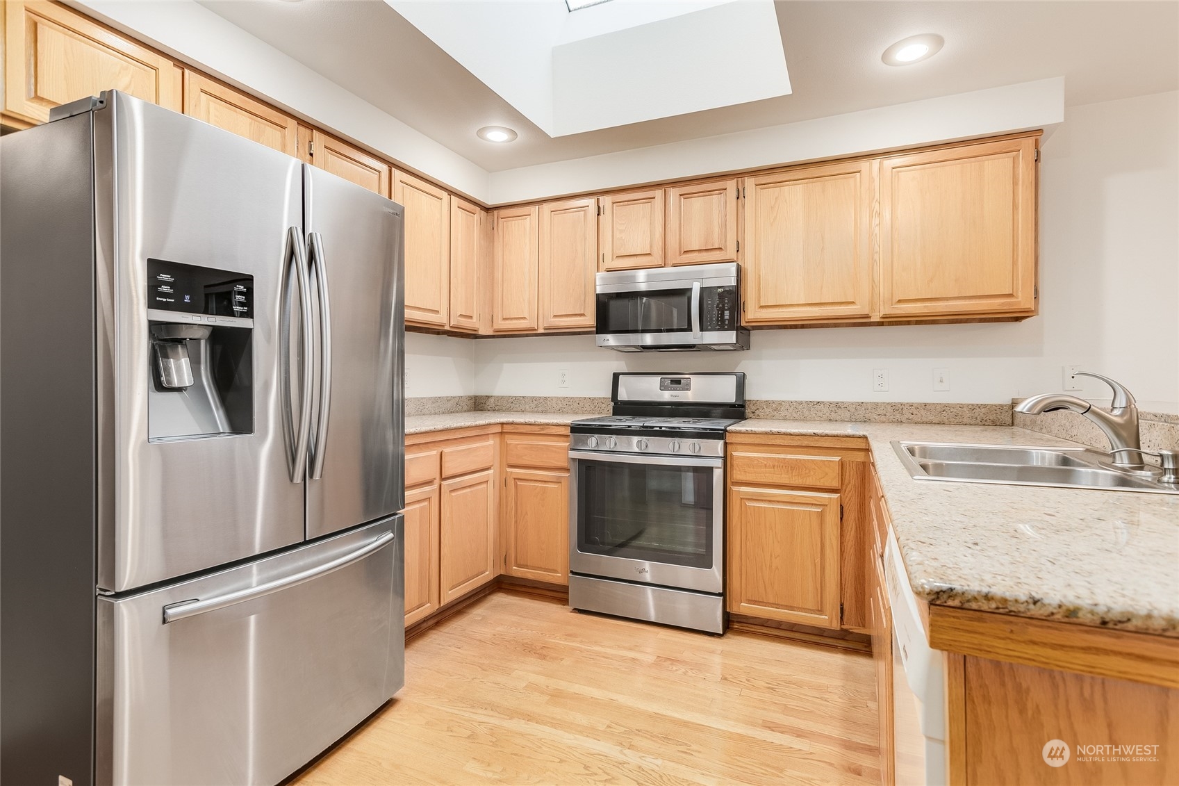 2667 Southwest 343rd Street Federal Way, WA 98023 - Photo 6 of 24 a kitchen with stainless steel appliances granite countertop a refrigerator sink and stove