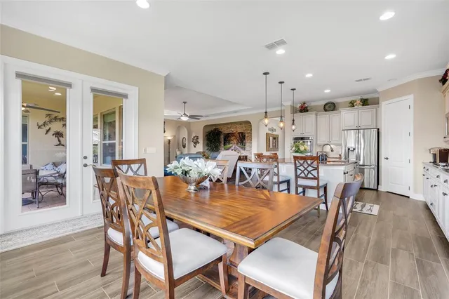 a dining room with furniture and a view of kitchen