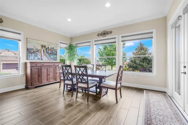 a dining room with furniture window wooden floor