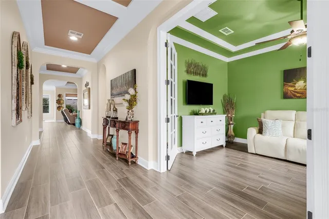 a view of a living room and a wooden floor