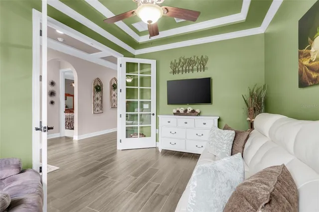 a living room with furniture and a flat screen tv