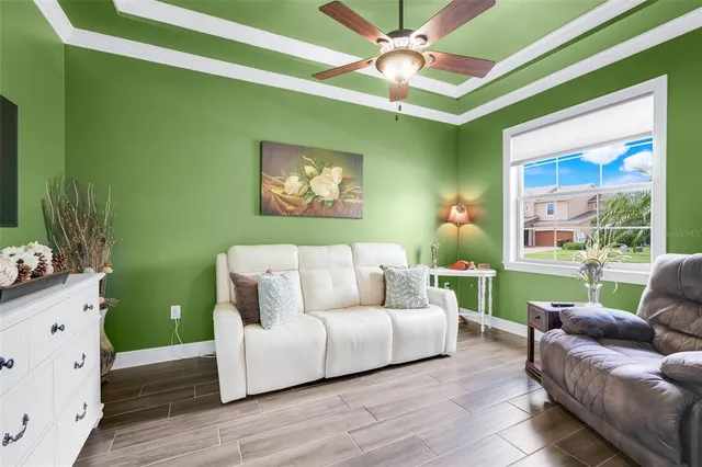 a living room with furniture and a large window