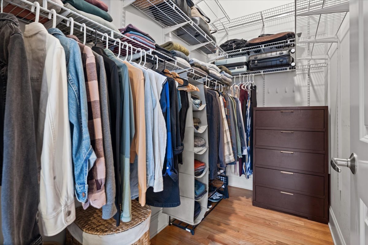 2310 West Nelson Street, Unit 302 Chicago, IL 60618 - Photo 16 of 20 a view of walk in closet with clothes and shoes