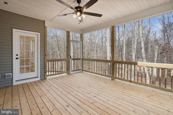 a view of a balcony with wooden floor