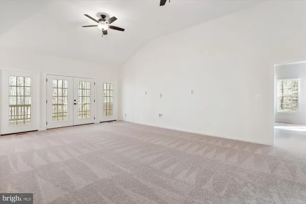 a view of an empty room with windows