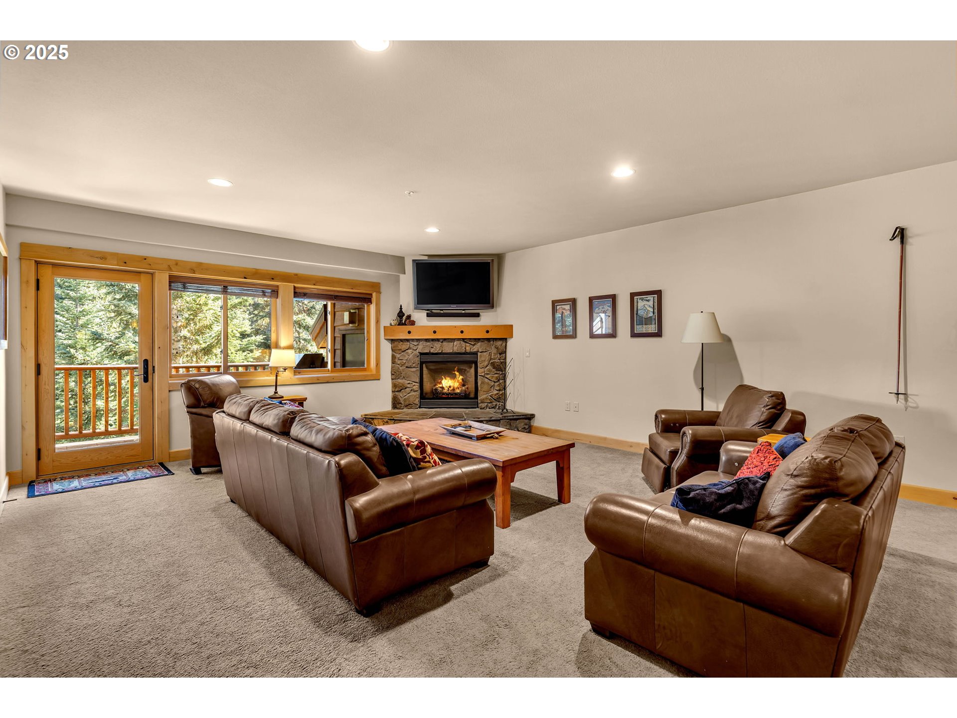 31254 East Collins Lake Road, Unit 22 Government Camp, OR 97028 - Photo 6 of 44 a living room with furniture and a flat screen tv