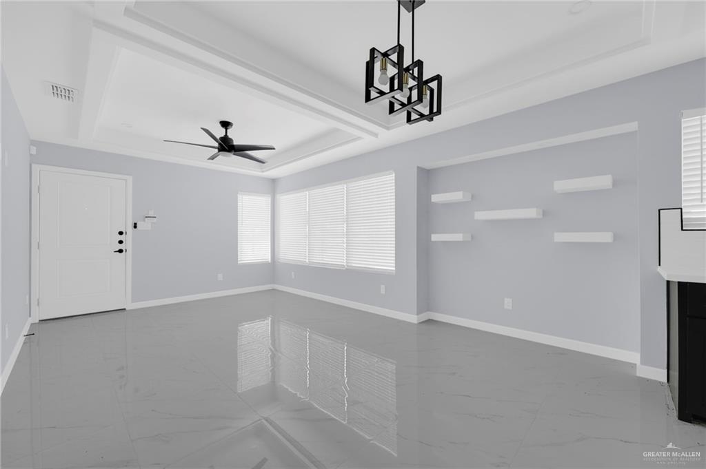 1620 Shadow Creek Drive, Unit 4 Weslaco, TX 78596 - Photo 3 of 12 a view of an empty room with a window