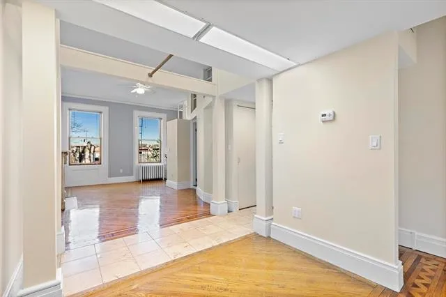 a view of livingroom with hardwood floor and a ceiling fan