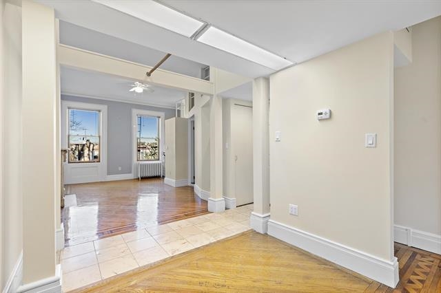 910 Hudson Street, Unit 3 Hoboken, NJ 07030 - Photo 8 of 14 a view of livingroom with hardwood floor and a ceiling fan