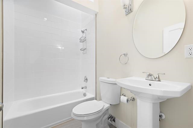 910 Hudson Street, Unit 3 Hoboken, NJ 07030 - Photo 9 of 14 a bathroom with a sink toilet and shower
