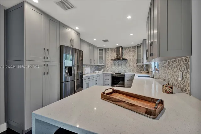 a kitchen with refrigerator cabinets and a counter top space