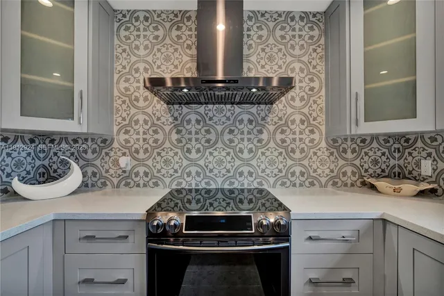 a kitchen with a stove and a sink