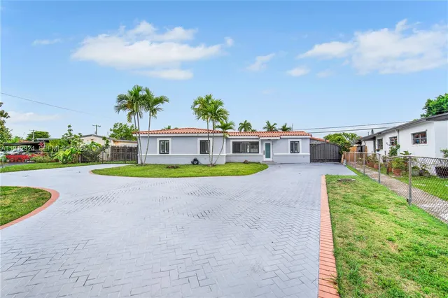a view of house with outdoor space and sitting area