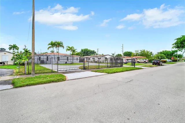 an aerial view of a house with garden space lake view and mountain view in back