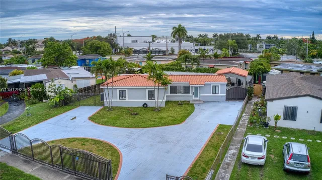 an aerial view of a house with outdoor space pool patio and outdoor seating