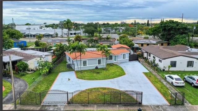 an aerial view of multiple house with yard