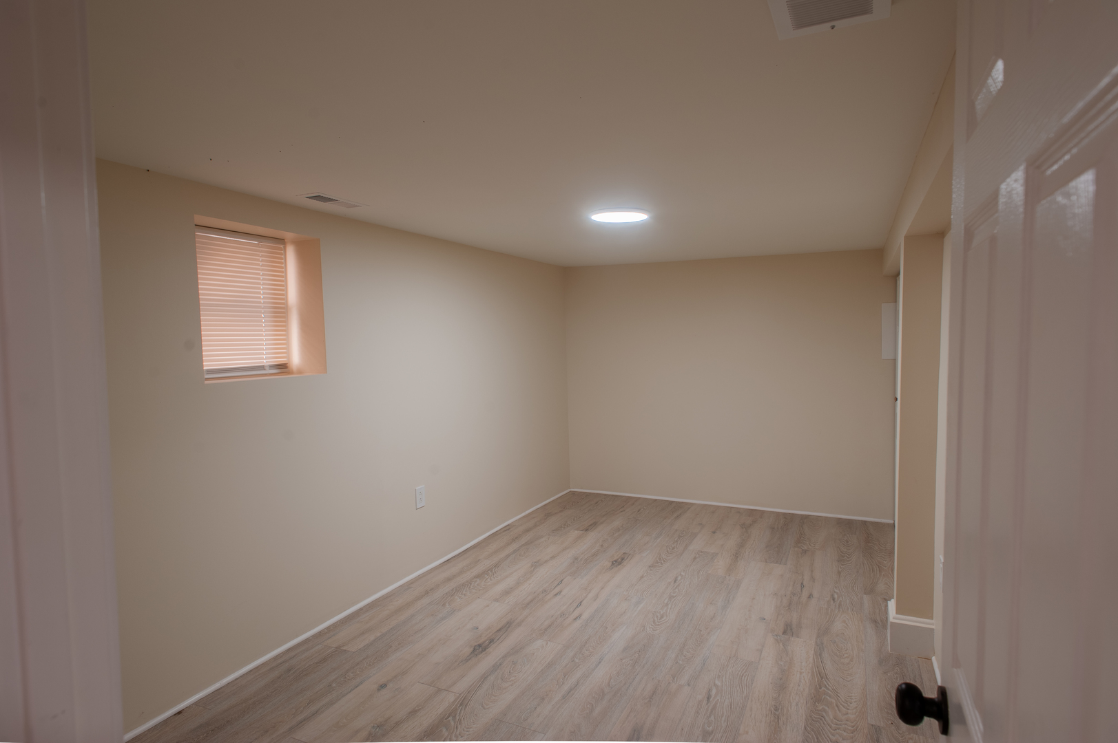 8620 South Union Avenue Chicago, IL 60620 - Photo 22 of 41 an empty room with wooden floor and windows