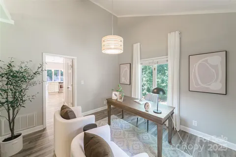 a view of a livingroom with furniture and window