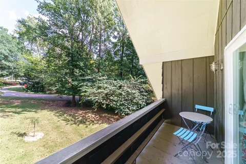 a view of a back yard from a balcony