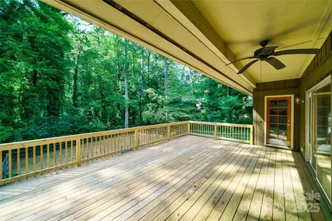 a view of balcony with wooden floor